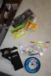 lot 295 image: Fishing Gear and Supplies - 4-pack Rubber Lures, (3) Lures, Multi-Tool, Spool of Fishing Line, (1) Reel, (2) Bobbers