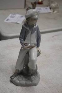 lot 318 image: Lladro 9 Sailor Boy theme Porcelain Figurine
