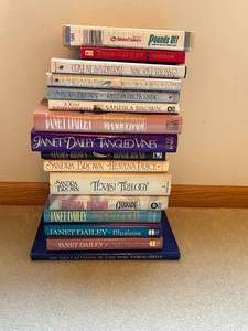 lot 240 image: Lot of Sandra Brown and Janet Dailey Books with Bonus Health Guide