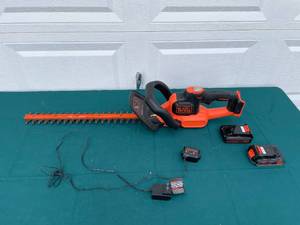 lot 9 image: BlackDecker 22-Inch Hedge Trimmer with Lithium Batteries and Charger