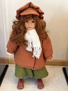 lot 172 image: Vintage Porcelain Doll in Winter Outfit