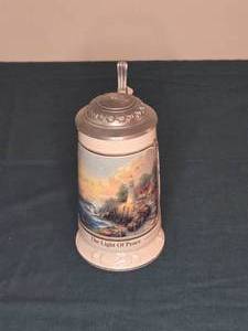 lot 329 image: Decorative Ceramic Beer Stein The Light of Peace with Pewter Lid