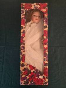lot 344 image: Porcelain Doll in Floral Box with Feather Detailing