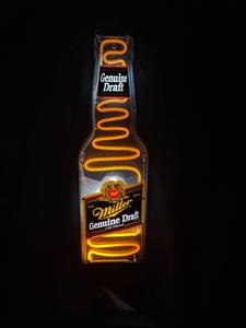 lot 103 image: Miller Genuine Draft Motion Bottle Neon Sign