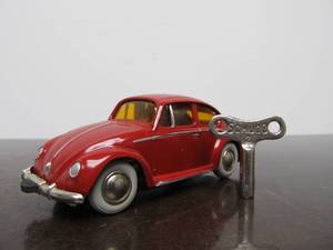 lot 45 image: Vintage SCHUCO Micro-Racer Race Car wKey - Red wYellow Windows Volkswagen