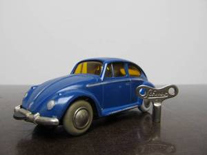lot 48 image: Vintage SCHUCO Micro-Racer Race Car wKey - Blue wYellow Windows Volkswagen