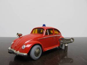 lot 52 image: Vintage SCHUCO&nbspMicro-Racer Race Car wKey - Red Volkswagen wSiren & Yellow Windows
