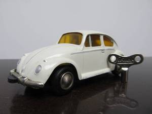 lot 55 image: Vintage SCHUCO Micro-Racer Race Car wKey - White Volkswagen wYellow Windows