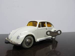 lot 60 image: Vintage SCHUCO Micro-Racer Race Car wKey - White Volkswagen wYellow Windows
