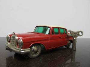 lot 61 image: Vintage SCHUCO Micro-Racer Race Car wKey - Red & White Mercedes 200S - BlueGreen Windows