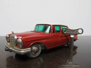 lot 62 image: Vintage SCHUCO Micro-Racer Race Car wKey - Red & White Mercedes 200S - BlueGreen Windows