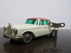 lot 64 image: Vintage SCHUCO Micro-Racer Race Car wKey - White & Red Mercedes 220S - BlueGreen Windows