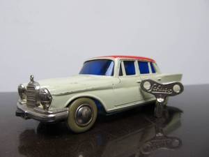 lot 69 image: Vintage SCHUCO Micro-Racer Race Car wKey - White & Red Mercedes 220S - Blue Windows