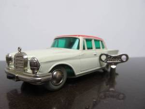 lot 70 image: Vintage SCHUCO Micro-Racer Race Car wKey - White & Red Mercedes 220S - BlueGreen Windows