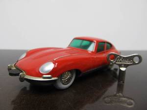 lot 86 image: Vintage SCHUCO Micro-Racer Car wKey - Red Jaguar E-Type wBlueGreen Windows