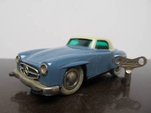 lot 89 image: Vintage SCHUCO Micro-Racer Car wKey - Greyish Blue & White Mercedes 190SL wBlue Windows