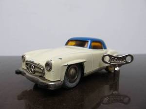 lot 90 image: Vintage SCHUCO Micro-Racer Car wKey - White & Blue Mercedes 190SL wYellow Windows