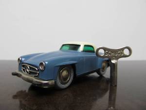 lot 99 image: Vintage SCHUCO Micro-Racer Car wKey - Greyish Blue & White Mercedes 190SL - BlueGreen Windows