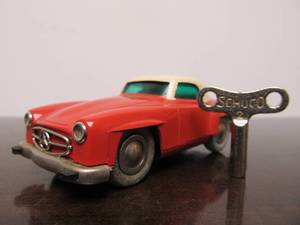lot 100 image: Vintage SCHUCO Micro-Racer Car wKey - Salmon Color & White Mercedes 190SL - BlueGreen Windows