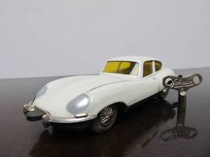 lot 102 image: Vintage SCHUCO Micro-Racer Car wKey - White Jaguar E-Type - Yellow Windows
