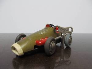 lot 120 image: Vintage SCHUCO Micro-Racer Race Car wKey - Gold wRed 1040