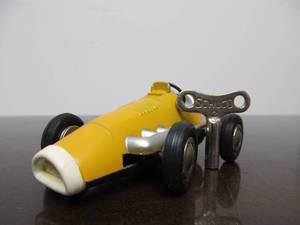 lot 130 image: Vintage SCHUCO Micro-Racer Race Car wKey - Yellow 1040