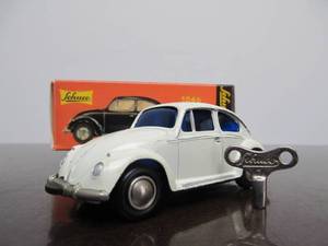 lot 161 image: Vintage SCHUCO Micro-Racer Race Car wKey - White Volkswagen Blue Windows wOriginal Box