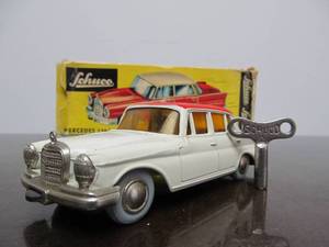 lot 178 image: Vintage SCHUCO Micro-Racer Car wKey - White & Red Mercedes 220S Yellow Windows wOriginal Box