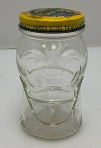 lot 7 image: Mid Century Anchor Hocking Glass Nash Peanut Butter Donald Duck Bank