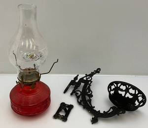 lot 35 image: Vintage Red Glass Oil Lamp With Cast Iron Wall Hanger