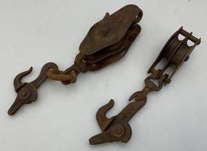 lot 46 image: Two Antique Metal Pulleys