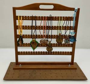 lot 159 image: Murano Stye Glass Pendants On Necklaces With Wood Jewelry Rack