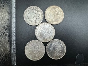 lot 79 image: Five 1921 Morgan Silver Dollars