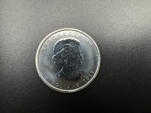 lot 82 image: 2011 BU One Ounce Silver Canadian Maple Leaf $5.00 Coin