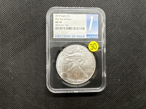 lot 30 image: 2019 American Silver Eagle FIRST DAY OF ISSUE NGC MS70 - NGC Price Guide is $60