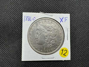 lot 12 image: 1886-O Morgan Silver Dollar Marked XF When Purchased
