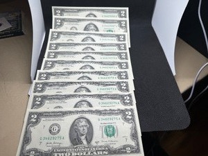 lot 100 image: 10 Sequential $2 bills
