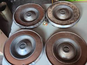 lot 14 image: 4-Vintage Ford Wheel Covers & Stat Tester
