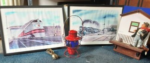 lot 33 image: Adlake Red Lantern With Blue Glass Globe, 2-Gil Reid Railroad Train Prints (23x17), Hobo Jack Bank & Wall Decor