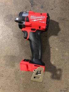 lot 19 image: Milwaukee M18 FUEL GEN-3 18V Lithium-Ion Brushless Cordless 12 in. Compact Impact Wrench with Friction Ring (Tool-Only)   Customer Returns See Pictures