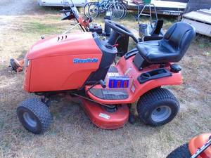 lot 100 image: Simplicity 22 hp twin hydro. Good condition. Runs but smokes. Probably needs valve adjustment.