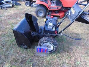 lot 102 image: MTD 8.5 hp 26 snow blower. Used condition. Tested & works. As shown.