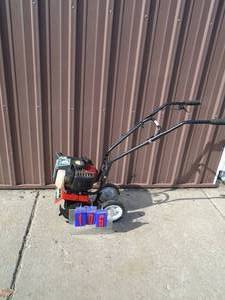 lot 106 image: Earthquake mini tiller. Used condition. Tested & works.