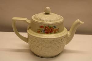 lot 62 image: Vintage Floral Ceramic Teapot with Embossed Design