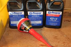 lot 130 image: Mopar Automatic Transmission Fluid and Funnel Lot