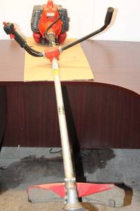 lot 215 image: Olympyk 8510 Gas-Powered Brush Cutter - Used Condition