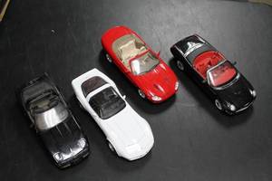 lot 974 image: Lot of 4 Die-Cast Model Cars - Black, Red, White Sports Cars