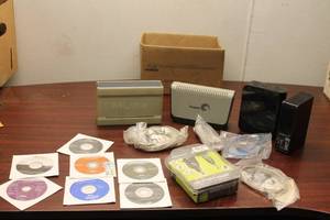 lot 631 image: Lot of 7 Dell Software Installation DVDs & Maxtor External Hard Drive Dock