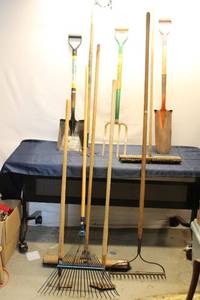 lot 673 image: Group of Assorted Garden Tools - Rakes, Shovels, and Forks