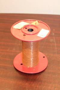 lot 696 image: Brown Electrical Wire Coil on Red Reel - 30MCE-130